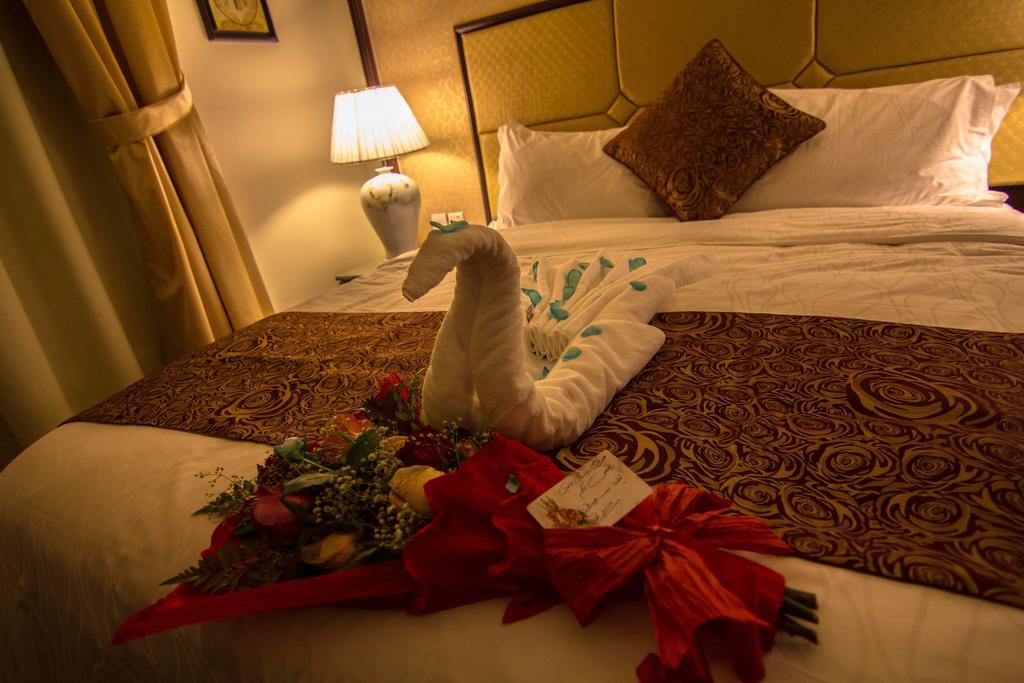 Rest Night Serviced Apartments- Alhamra Riad Cameră foto A towel swan